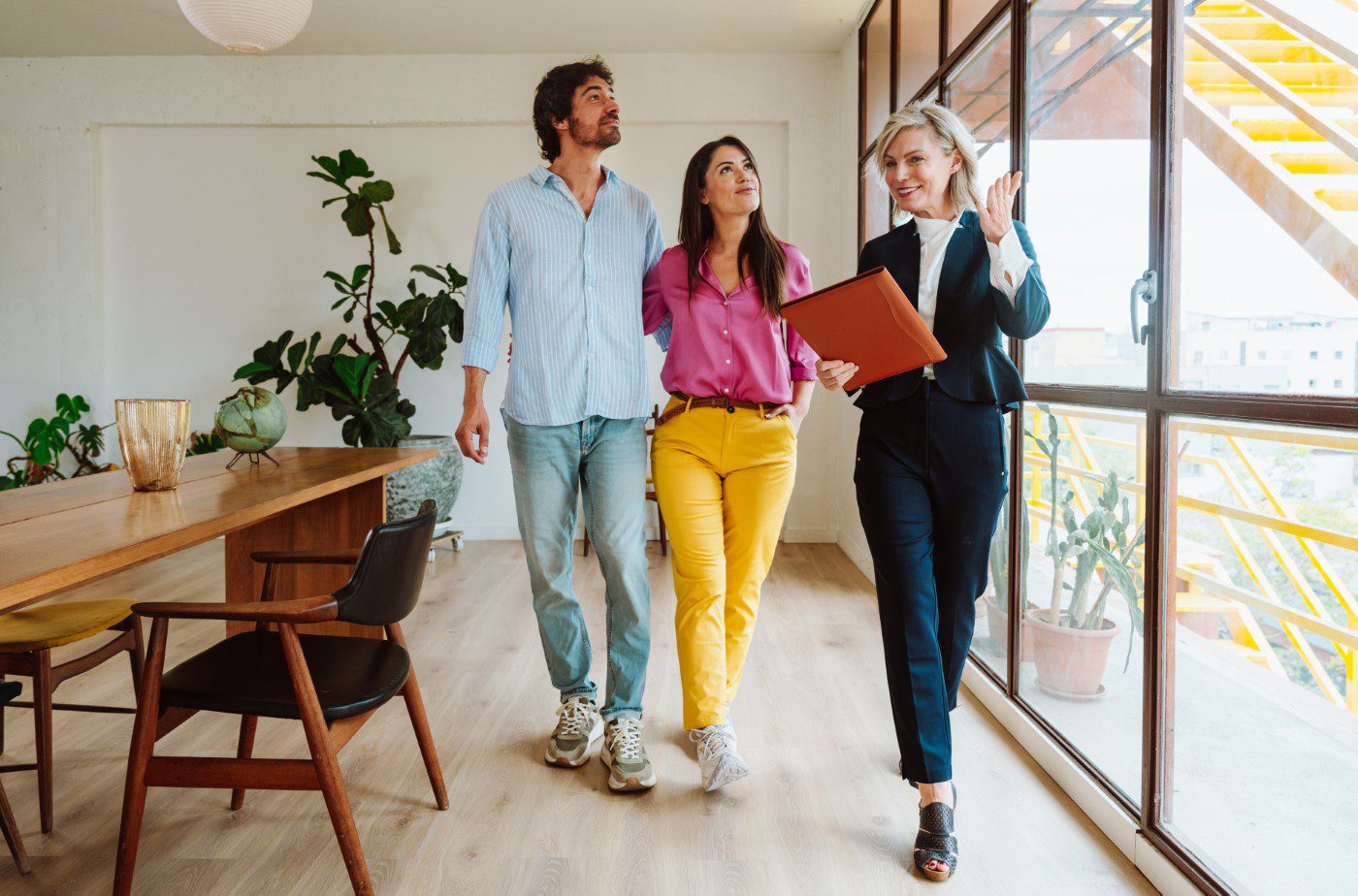 Real estate agent showing modern apartment