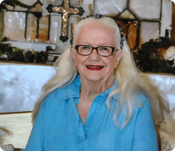 Elderly woman with glasses and long hair